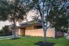 Modern home with Outdoor, Stone Fences, Wall, Front Yard, Wood Fences, Wall, Landscape Lighting, Horizontal Fences, Wall, Walkways, Trees, and Hardscapes. Exterior View Photo 2 of McClendon Residence
