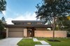 Modern home with Exterior, Wood Siding Material, House Building Type, Brick Siding Material, and Flat RoofLine. Exterior View Photo 3 of McClendon Residence