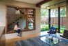 Modern home with Living Room, Bookcase, Bench, Chair, and Coffee Tables. Interior View Photo 10 of McClendon Residence
