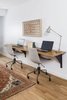 The family study features a 9 foot floating white oak desk with custom L-beam brackets by A. R. Lucas Construction. Photo 8 of St. Johns House modern home