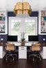 Across from the craft area we built a custom 30" deep desk with stained pecan top, central trash bin pull out, file storage on either side, and concealed wire storage cabinet with an easy access panel. An accent wall of Serena & Lily wallpaper and chandelier by Aerin really bring an elegant touch to this home office. Photo 3 of Mueller Home Office modern home