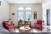 Living Area with loads of natural light, texture and color. Photo 6 of Modernist Spec House modern home