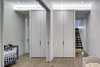 Modern home with Interior, Metal, Sliding Door Type, Bed, and Medium Hardwood Floor. Lower level: Children's Bedrooms
On the lower level, the use of pocketed sliding doors met an imperative client requirement. It allowed the children’s bed/playroom to be a flexible space - subdivided for sleep and open for play. Additional sliding glazed doors at the two entries to the bedrooms from the family room, facilitate deep penetration of natural indirect daylighting from the bedroom windows into the family area. Photo 13 of Noho Duplex, New York