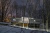 View from road, winter Photo 3 of Woodland Dune Home modern home