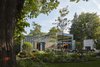 Modern home with Back Yard, Grass, Large Patio, Porch, Deck, Exterior, House Building Type, and Metal Siding Material. north elevation Photo 3 of Courtyard Residence