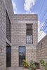 Modern home with Outdoor, Front Yard, Horizontal Fences, Wall, Vegetables, Flowers, Concrete Patio, Porch, Deck, and Concrete Fences, Wall. main access Photo 2 of Melón House