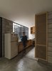 Modern home with Kitchen, Wood Counter, Ceiling Lighting, Refrigerator, Wood Cabinet, Drop In Sink, and Concrete Floor. kitchen area Photo 4 of Melón House