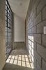 Modern home with Hallway and Concrete Floor. the final narrative of the project was honesty in their exposed materials Photo 7 of Melón House