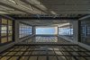 a game of reflections is created by the handmade smithy and windows. Photo 16 of Melón House modern home