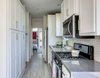 Kitchen with Pantry - full sized appliances - Palm Canyon Mobile Club Photo 9 of Tiny Homes in Palm Springs modern home