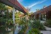 Modern home with Back Yard, Stone Patio, Porch, Deck, Infinity Pools, Tubs, Shower, Large Pools, Tubs, Shower, Salt Water Pools, Tubs, Shower, Grass, and Outdoor. A 200-foot winding bridge connects the front of the home to the rear. Photo 3 of Pine Tree North