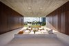 Modern home with Trees, Gardens, Concrete Patio, Porch, Deck, Shrubs, and Hallway. The outdoor kitchen is hidden by accordion style teak doors. Photo 5 of Pine Tree North