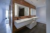 Modern home with Walkways, Horizontal Fences, Wall, Large Patio, Porch, Deck, Planters Patio, Porch, Deck, Decking Patio, Porch, Deck, Hardscapes, Grass, Shrubs, Trees, Front Yard, Boulders, Sectional, Bed, Night Stands, Wall Lighting, Ceiling Lighting, Engineered Quartz Counter, Ceramic Tile Floor, Concrete Floor, and Undermount Sink. master bath Photo 11 of Atlantic Beach Modern
