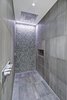 Modern home with Hardscapes, Large Patio, Porch, Deck, Walkways, Planters Patio, Porch, Deck, Decking Patio, Porch, Deck, Horizontal Fences, Wall, Grass, Shrubs, Trees, Front Yard, Boulders, Sectional, Bed, Night Stands, Wall Lighting, Ceiling Lighting, Engineered Quartz Counter, Ceramic Tile Floor, Concrete Floor, and Undermount Sink. master shower Photo 12 of Atlantic Beach Modern