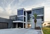 Modern home with Back Yard, Concrete Pools, Tubs, Shower, Hardscapes, Walkways, Small Pools, Tubs, Shower, Large Patio, Porch, Deck, Planters Patio, Porch, Deck, Decking Patio, Porch, Deck, Horizontal Fences, Wall, Swimming Pools, Tubs, Shower, Grass, Shrubs, Trees, and Outdoor. street facing facade Photo 6 of Atlantic Beach Modern