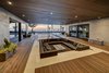 Modern home with Back Yard, Large Patio, Porch, Deck, Hardscapes, Small Pools, Tubs, Shower, Walkways, Concrete Pools, Tubs, Shower, Planters Patio, Porch, Deck, Decking Patio, Porch, Deck, Horizontal Fences, Wall, and Outdoor. Covered deck, sunken fire pit, and pool Photo 3 of Atlantic Beach Modern