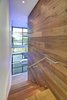 Modern home with Hardscapes, Walkways, Large Patio, Porch, Deck, Planters Patio, Porch, Deck, Decking Patio, Porch, Deck, Horizontal Fences, Wall, Grass, Shrubs, Trees, Front Yard, Boulders, Sectional, Bed, Night Stands, Wall Lighting, Ceiling Lighting, Engineered Quartz Counter, Ceramic Tile Floor, Concrete Floor, and Undermount Sink. stair tower Photo 14 of Atlantic Beach Modern