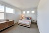 Modern home with Bed, Chair, Dresser, Table Lighting, Carpet Floor, and Bedroom. guest bedroom Photo 2 of Cedarbrook Net Zero Modern