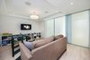 Modern home with White Cabinet, Wood Tread, Wood Cabinet, Ceramic Tile Backsplashe, Refrigerator, Range, Range Hood, Dishwasher, Wood Railing, Metal Fences, Wall, and Kitchen. Sliding Door Co. doors in basement, hiding office and guest BR Photo 17 of 30th Street Residence