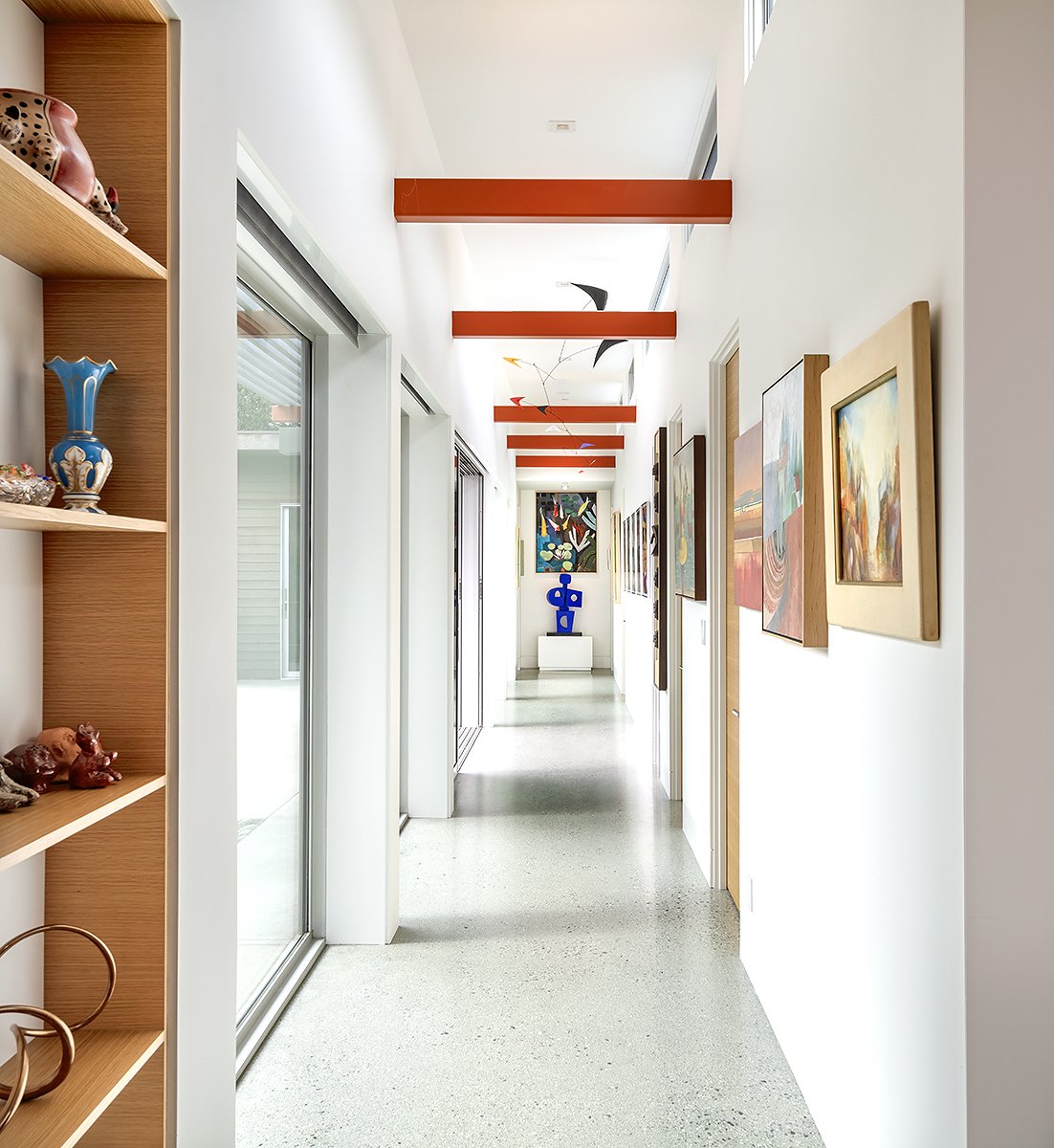 The gallery-like hallway leads to the back of the house.