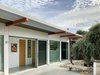 Modern home with Exterior. The house is designed around a leaning Australian Tea Tree, show at the right. Photo 13 of Oak Street