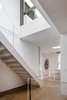 Modern home with Staircase, Glass Railing, and Wood Tread. stair to rooftop garden Photo 2 of San Francisco Apartment
