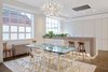 Modern home with Kitchen, Engineered Quartz Counter, Recessed Lighting, Refrigerator, Dishwasher, Light Hardwood Floor, White Cabinet, Cooktops, Microwave, Undermount Sink, and Range Hood. elevator down Photo 5 of San Francisco Apartment