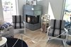 Modern home with Living Room, Bookcase, Wood Burning Fireplace, Corner Fireplace, Storage, and Shelves. fleimio trolley in the living room. Photo of Villa Albatrossi
