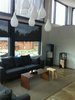 Modern home with Living Room, Storage, Corner Fireplace, Wood Burning Fireplace, and Ceiling Lighting. fleimio trolley on the second floor. Photo of Architect House