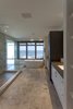 Modern home with Bed, Ceiling Lighting, Dark Hardwood Floor, and Bath Room. Owner's Bathroom with view of Atlantic Ocean Photo 2 of NJPV