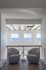 Modern home with Bed, Ceiling Lighting, Dark Hardwood Floor, Engineered Quartz Counter, Travertine Floor, Undermount Sink, Freestanding Tub, Enclosed Shower, and Hallway. Owner's sitting balcony Photo 3 of NJPV