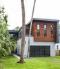 Modern home with Outdoor, Front Yard, Trees, Grass, Hardscapes, and Walkways. Street View Photo of HoF