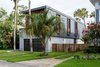 Modern home with Exterior, House Building Type, Stucco Siding Material, Metal Siding Material, and Wood Siding Material. Street View Photo 3 of HoF