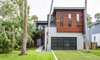 Modern home with Exterior, House Building Type, Wood Siding Material, Metal Siding Material, and Stucco Siding Material. Street View Photo 5 of HoF