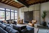 Modern home with Living Room, Chair, Coffee Tables, Sectional, Accent Lighting, and Concrete Floor. Great Room Photo 11 of HoF