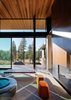 Modern home with Living Room, Ottomans, Ribbon Fireplace, Bench, Concrete Floor, and Gas Burning Fireplace. Living Room Photo 6 of Martis Camp Residence I