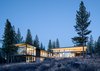 Modern home with Outdoor, Back Yard, Boulders, Trees, Shrubs, Flowers, and Large Patio, Porch, Deck. Rear Facade Photo of Martis Camp Residence I