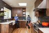Modern home with Kitchen, Wood Cabinet, Quartzite Counter, Ceramic Tile Backsplashe, Medium Hardwood Floor, Ceiling Lighting, and Drop In Sink. A conventionally attractive kitchen didn't suit Holly + Magda, so we opted for a bold materials palette: western walnut cabinetry, gunmetal tile, and white quartzite countertops.
For more info, go to: https://www.howellsarc.com/projects/holly-magda/ Photo of Holly + Magda