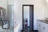 Modern home with Bath Room and Linoleum Floor. Master Bath: Ikea cabinetry and marmoleum floors kept the budget low. Photo 3 of Dan + Jenni