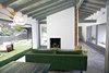 Modern home with Living Room, Ottomans, Sofa, Porcelain Tile Floor, Two-Sided Fireplace, Track Lighting, and Pendant Lighting. The original rear wall of the house had one small sliding glass door, and several fixed windows that had been broken and water damaged. Two NanaWall bifold glass walls replaced the windows, opening the entire back wall to indoor-outdoor living. Photo 10 of Diablo Ranch