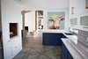 Modern home with Kitchen, Colorful Cabinet, Subway Tile Backsplashe, Marble Counter, Porcelain Tile Floor, Porcelain Tile Backsplashe, Recessed Lighting, and Undermount Sink. To keep this farmhouse modern, familiar items in new colors make the design exciting. Navy cabinets, gold tree trunks, a technicolor cow painting, and pinstripe marble counters add surprise and a touch of whimsy. Photo 14 of Diablo Ranch
