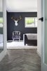 Modern home with Bedroom, Chair, Bed, Recessed Lighting, and Porcelain Tile Floor. A gold-antlered ceramic deer head hangs above a flea market Chinoiserie chair in the master bedroom. Photo 19 of Diablo Ranch