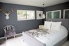 Modern home with Bedroom, Bed, Chair, Pendant Lighting, and Porcelain Tile Floor. The master bed floats in the middle of the room, so the waking view is of the gardens and fountain. Photo 20 of Diablo Ranch