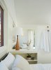 Modern home with Colorful Cabinet, Refrigerator, Dark Hardwood Floor, Concrete Counter, Pendant Lighting, Cooktops, Undermount Sink, Bedroom, and Dishwasher. Interior view from sleeping area to living area Photo 4 of Lake Harriet Loft