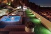 Modern home with Outdoor. Pool deck area at night Photo of Casa Klamar