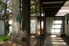 Modern home with Exterior, Mid-Century Building Type, House Building Type, Concrete Siding Material, and Flat RoofLine. Windchime at Entry Photo 4 of Kalamazoo Post and Beam Restoration