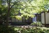 Modern home with Exterior, Mid-Century Building Type, House Building Type, Wood Siding Material, Concrete Siding Material, and Flat RoofLine. Exterior Photo 6 of Kalamazoo Post and Beam Restoration