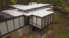 Modern home with Exterior, House Building Type, Mid-Century Building Type, Flat RoofLine, and Concrete Siding Material. New flat roof Photo 12 of Kalamazoo Post and Beam Restoration
