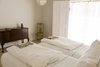 Modern home with Bedroom, Bed, Dresser, Chair, Pendant Lighting, and Light Hardwood Floor. heirloom mahogany chest; vintage painted chair; Baby & Child linen chandelier to complement linen bedding and towels Photo 2 of PILGRIM HOUSE