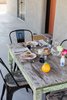 Modern home with Table, Outdoor, and Large Patio, Porch, Deck. weathered table from Mexico, Choisy Le Roi dishes, LinenMe napkins, espresso cups by Bennington Potters Photo 5 of PILGRIM HOUSE